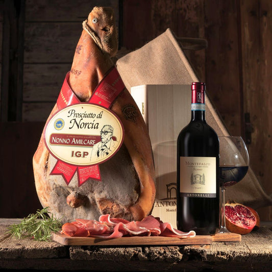 Cesto di Natale "Norcia" - Prosciutto IGP Norcia intero con osso e Montefalco Rosso DOC BIO in cassetta legno